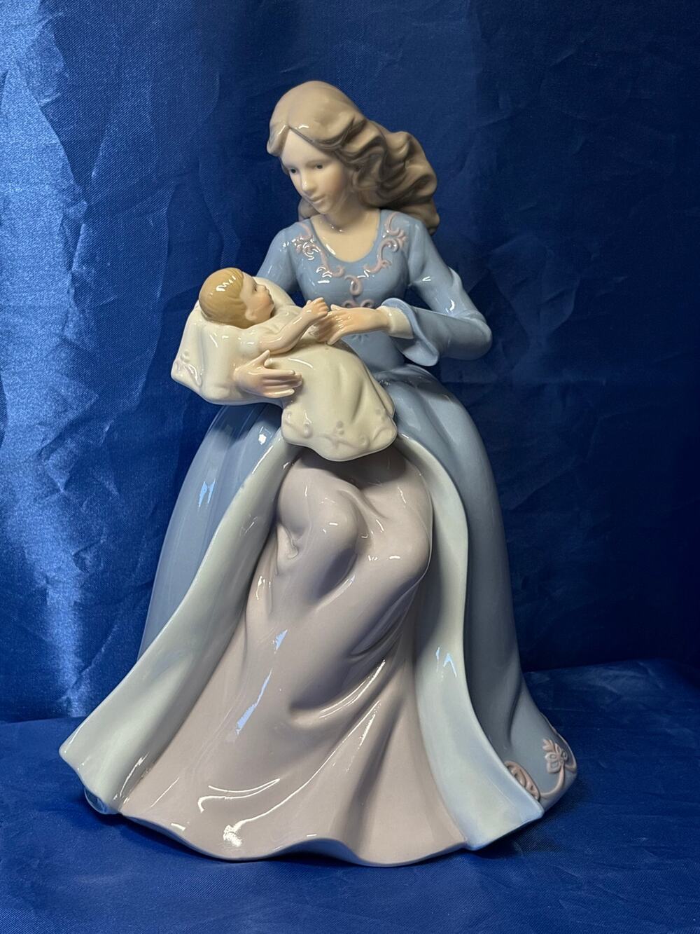 Gloss Finish Porcelain Figurine of Mother Holding a Baby